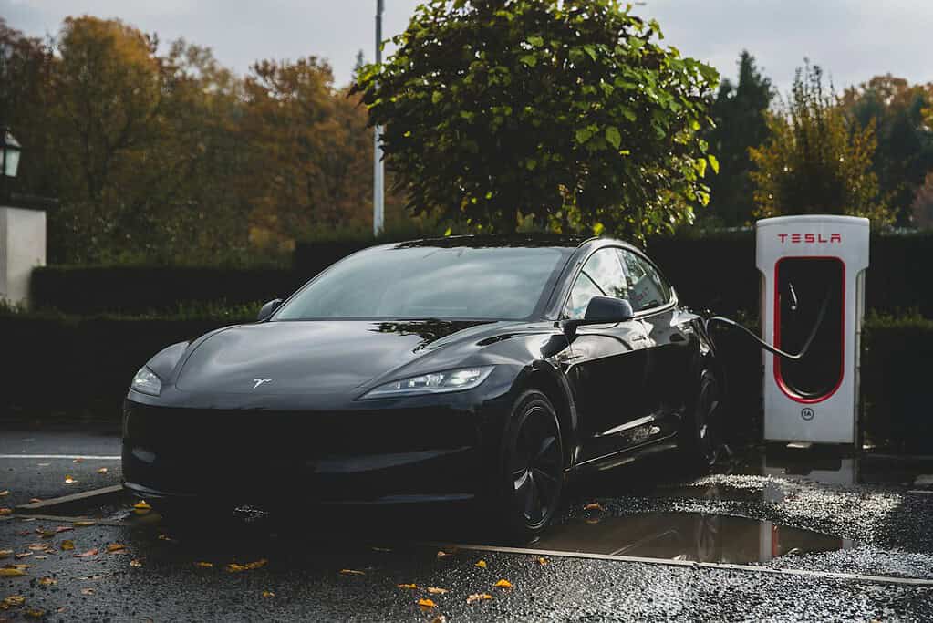 Illustrative archival photograph: Tesla Model 3 Highland charging. Photo by Bram Van Oost on Unsplash; not an image of the October 2026 announcement.