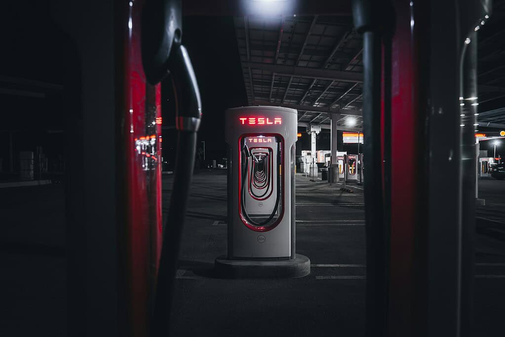 Illustrative archival photograph: Tesla Superchargers chargers reference. Photo by Jonathan Ikemura on Unsplash; not an image of the October 2026 announcement.